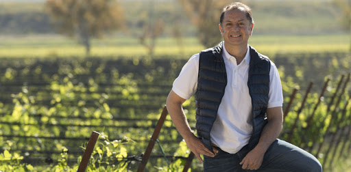 Fabián Valenzuela, lead winemaker at Fincas Patagónicas, standing among the vines